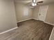 Living room with wood-look floors and lots of natural light at 3208 E Powhatan Ave, Tampa, FL 33610