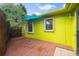 Backyard with wooden deck and green wall at 1401 Bay Palm Blvd, Indian Rocks Beach, FL 33785