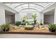 Indoor atrium with plants and water features creates a relaxing atmosphere at 500 Treasure Island Cswy # 406, Treasure Island, FL 33706