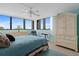 Bright bedroom with large windows and a ceiling fan at 500 Treasure Island Cswy # 406, Treasure Island, FL 33706