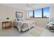 Bedroom boasts a large window view and a cozy reading nook for relaxation at 500 Treasure Island Cswy # 406, Treasure Island, FL 33706