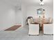 Dining room with a wood table, six chairs and a mirror at 500 Treasure Island Cswy # 406, Treasure Island, FL 33706