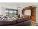 Living room with furniture, TV and sliding doors to outside balcony at 500 Treasure Island Cswy # 406, Treasure Island, FL 33706