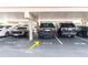Assigned parking spot in a covered parking garage with marked spaces at 500 Treasure Island Cswy # 406, Treasure Island, FL 33706