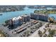 Aerial view of a waterfront community with parking and buildings at 500 Treasure Island Cswy # 406, Treasure Island, FL 33706