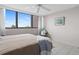 Spacious bedroom with tiled floors and window views at 500 Treasure Island Cswy # 406, Treasure Island, FL 33706