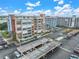 Aerial view of a multi-story building and parking lot at 500 Treasure Island Cswy # 406, Treasure Island, FL 33706