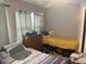 Bedroom with two twin beds and dresser at 120 S San Remo Ave, Clearwater, FL 33755