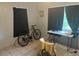 Bedroom with tiled floor, bicycle, and a work table at 120 S San Remo Ave, Clearwater, FL 33755