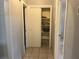 A hallway with a sliding door closet and tiled floor at 120 S San Remo Ave, Clearwater, FL 33755