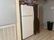 Kitchen area with refrigerator and cabinetry at 120 S San Remo Ave, Clearwater, FL 33755