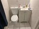 Small bathroom with toilet, sink, and vanity at 120 S San Remo Ave, Clearwater, FL 33755