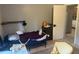 Small bedroom with a twin bed and minimal furniture at 120 S San Remo Ave, Clearwater, FL 33755