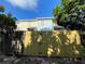 Rear view of house with wooden fence at 11335 Grandville Dr, Temple Terrace, FL 33617
