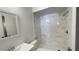 Updated bathroom with marble-style shower and modern vanity at 11335 Grandville Dr, Temple Terrace, FL 33617