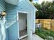 Exterior storage area with water heater and AC unit at 11335 Grandville Dr, Temple Terrace, FL 33617