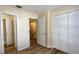 Bedroom with wood-look flooring and ample closet space at 11335 Grandville Dr, Temple Terrace, FL 33617