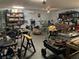 Garage workshop with tools, storage shelves, and workspace at 2307 7Th Sw St, Ruskin, FL 33570