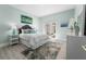 Bedroom with patio access and stylish decor at 4950 Gulf Blvd # 104, St Pete Beach, FL 33706