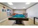 Game room featuring a billiard table and comfortable seating at 4950 Gulf Blvd # 104, St Pete Beach, FL 33706