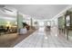 Spacious community room with seating areas and dining tables at 4950 Gulf Blvd # 104, St Pete Beach, FL 33706