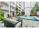 Courtyard with fountain, seating area, and tropical landscaping at 4950 Gulf Blvd # 104, St Pete Beach, FL 33706