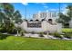 Beau Monde building entrance with landscaping and signage at 4950 Gulf Blvd # 104, St Pete Beach, FL 33706