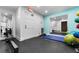Fitness room with rowing machine, exercise balls, and mats at 4950 Gulf Blvd # 104, St Pete Beach, FL 33706