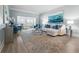 Spacious living room with coastal decor and hardwood floors at 4950 Gulf Blvd # 104, St Pete Beach, FL 33706