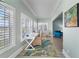 Home office with built-in desk and window seat, offering natural light at 4950 Gulf Blvd # 104, St Pete Beach, FL 33706