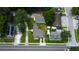 An aerial view of the house, showcasing its position on a tree-lined street at 911 8Th Sw Ave, Largo, FL 33770