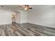 This expansive bedroom features wood floors and an adjacent bathroom with a large vanity at 911 8Th Sw Ave, Largo, FL 33770