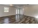 This bright living room offers wood-look floors and neutral walls, creating a modern aesthetic at 911 8Th Sw Ave, Largo, FL 33770