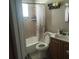 Clean bathroom with tub, toilet and vanity at 7212 Delano Ave, Tampa, FL 33619