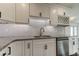 Modern kitchen with granite countertops and white shaker cabinets at 911 8Th Sw Ave, Largo, FL 33770