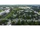 Aerial view of neighborhood, featuring houses, roads, and lush green spaces at 911 8Th Sw Ave, Largo, FL 33770