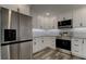Modern kitchen with stainless steel appliances and white cabinets at 911 8Th Sw Ave, Largo, FL 33770