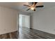 Spacious bedroom with ceiling fan and gray vinyl flooring at 911 8Th Sw Ave, Largo, FL 33770