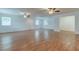 Large living room with hardwood floors and ceiling fans at 911 8Th Sw Ave, Largo, FL 33770