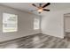 Spacious bedroom with ceiling fan and gray vinyl flooring at 911 8Th Sw Ave, Largo, FL 33770