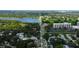 Aerial perspective of a residential area near a lake and high-rise building at 911 8Th Sw Ave, Largo, FL 33770