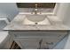 White vanity with marble countertop and sink at 911 8Th Sw Ave, Largo, FL 33770