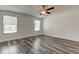 Well-lit bedroom with two windows and gray vinyl flooring at 911 8Th Sw Ave, Largo, FL 33770