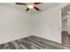 Bright bedroom with ceiling fan and hardwood floors at 911 8Th Sw Ave, Largo, FL 33770