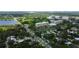 Aerial perspective of a residential area near a lake and high-rise building at 911 8Th Sw Ave, Largo, FL 33770