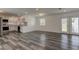 Open concept living and kitchen space featuring hardwood floors and modern appliances at 911 8Th Sw Ave, Largo, FL 33770