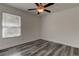 Bedroom with window, ceiling fan, and vinyl flooring at 911 8Th Sw Ave, Largo, FL 33770