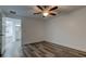 Bright bedroom with ceiling fan and vinyl plank flooring at 911 8Th Sw Ave, Largo, FL 33770