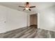 Large bedroom with wood-look floors and double doors leading to an office at 911 8Th Sw Ave, Largo, FL 33770