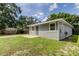 Newly built home with gray siding and a detached garage at 911 8Th Sw Ave, Largo, FL 33770